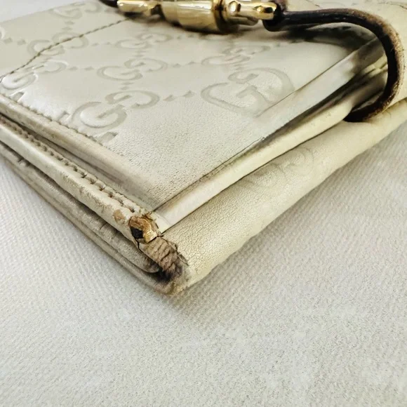 Gucci Guccissima Ivory Leather GG Logo BiFold Wallet, Gold Piston Closure